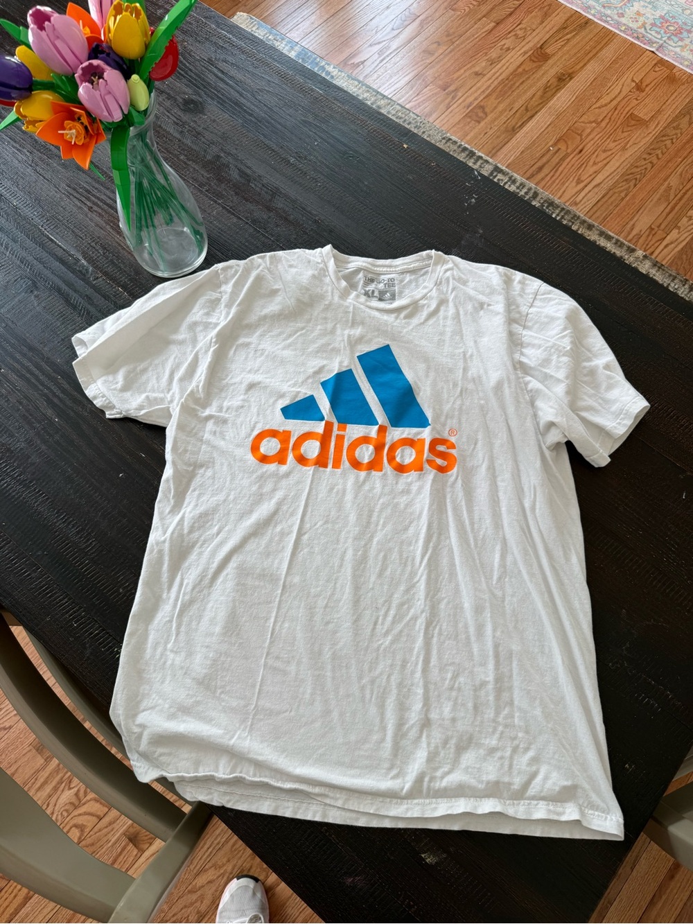 adidas White Short-Sleeve Tee with Blue Logo and Orange Wordmark